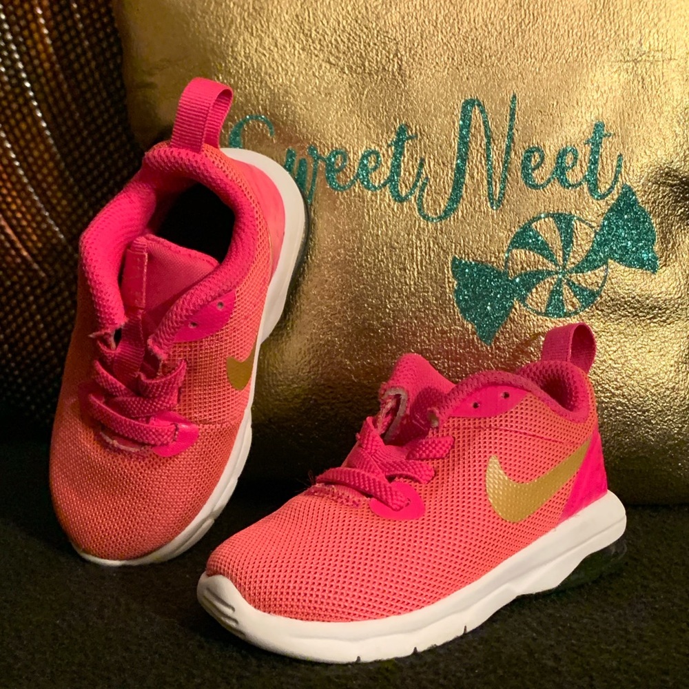 Nike fuchsia pink w/ gold swoosh sneakers